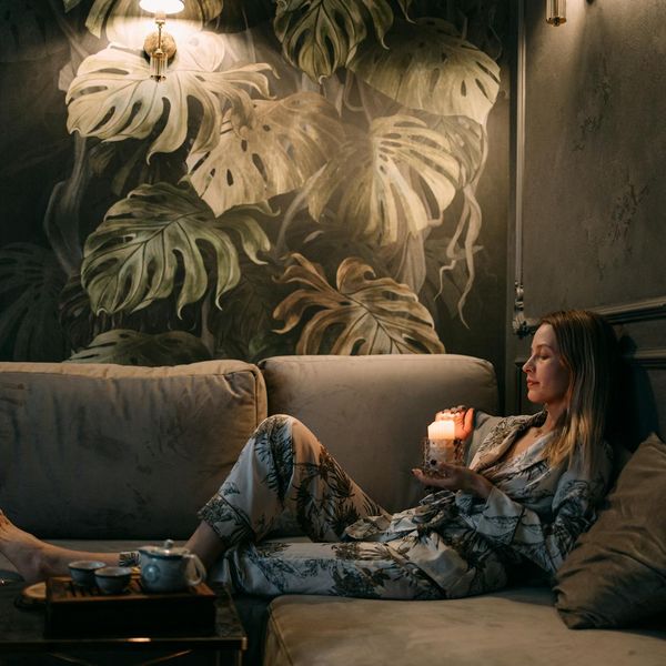 Woman in a relaxed state, embodying the calm of an evening practice